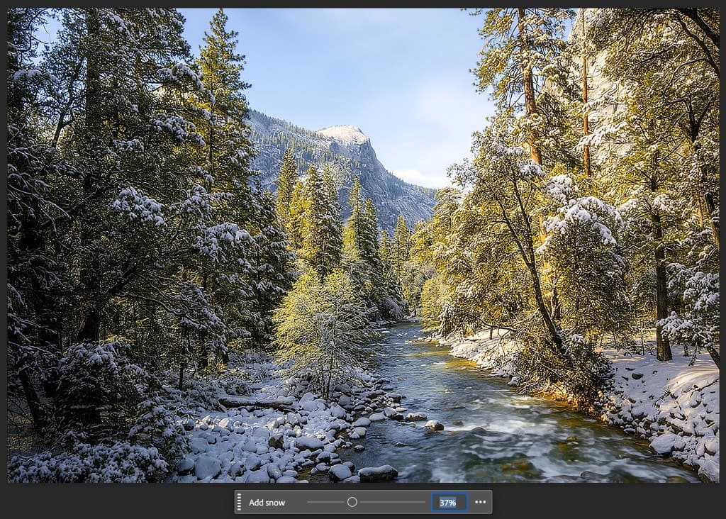 Photoshop Contextual Task Bar with a Dynamic Layer Add snow slider set to 37 percent over a winter river landscape